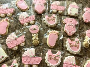 <p>
  <img src="Baby stroller cookies.jpg" alt="Baby shower, baby stroller cookies colored pink and gold.">
  Example photo of custom decorated sugar cookie with a pink and gold baby shower theme ...
</p>