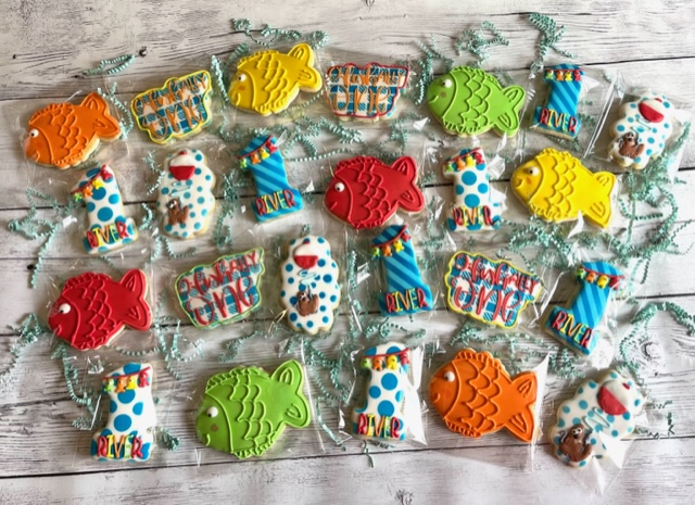 Colorful fish cookies with various art designs.