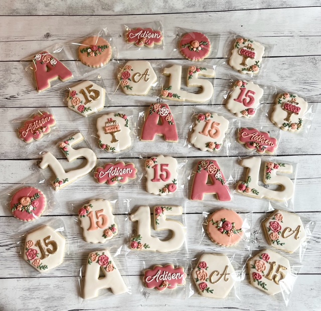 Cookie photo of custom pink color baby celebration cookies.