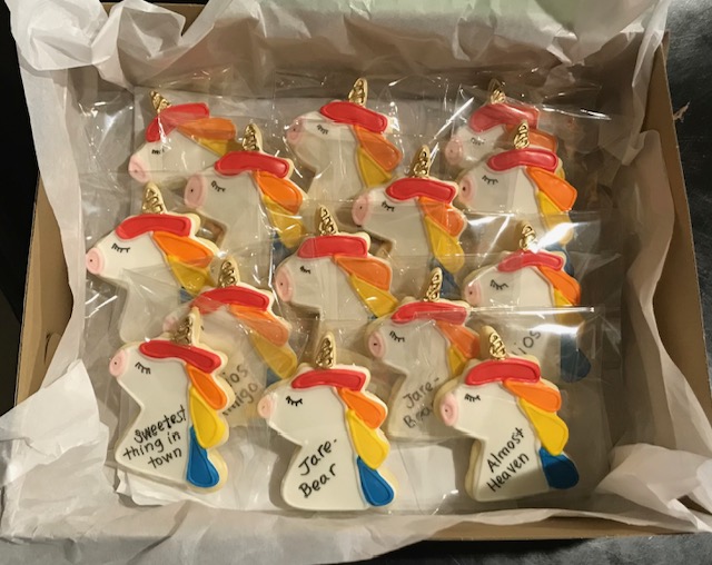 Picture of cookies with a colorful unicorn theme.
