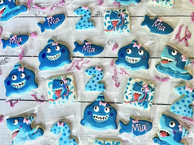 Blue shark decorated overall custom sugar cookies