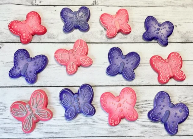 close up image of Pink and purple butterfly decorated sugar cookie image.