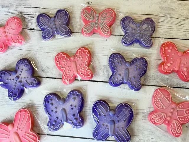 Pink and purple butterfly decorated sugar cookie image.