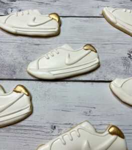 Sugar cookie shoe white checkmark with gold.